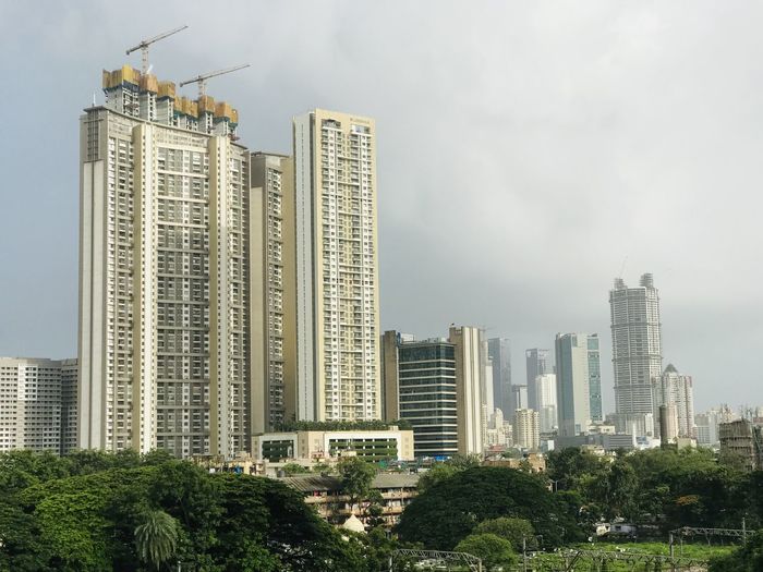 Modern buildings against sky in city