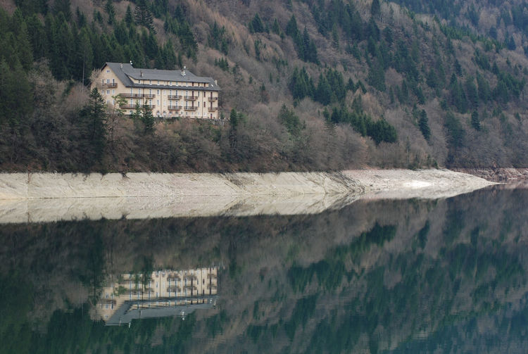 Reflection of building in calm lake
