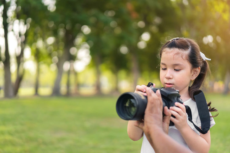Portrait of girl photographing