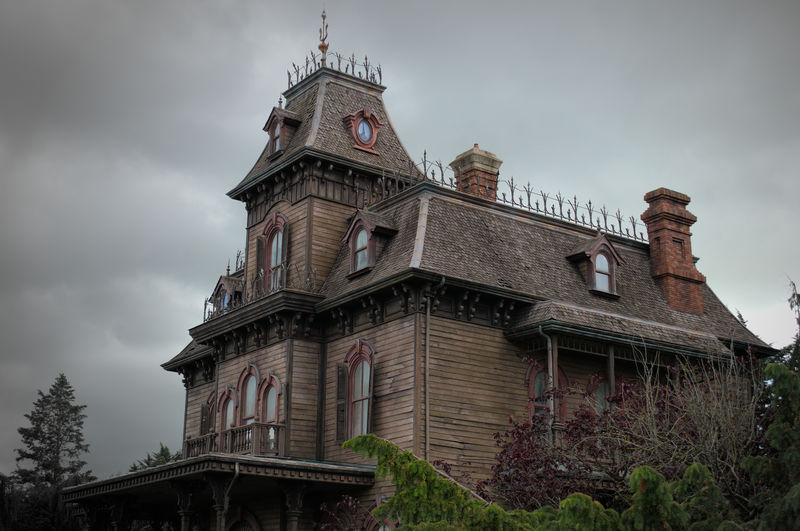 Low angle view of the phantom manor against cloudy sky