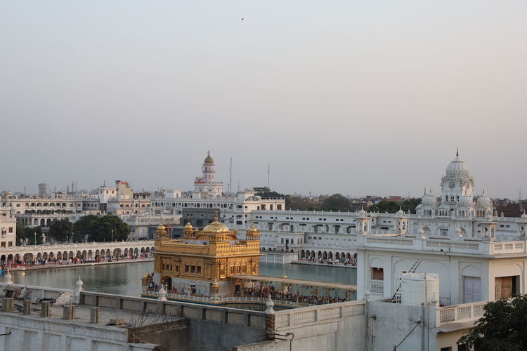 High angle view of buildings in city against sky, golden temple amritsar 