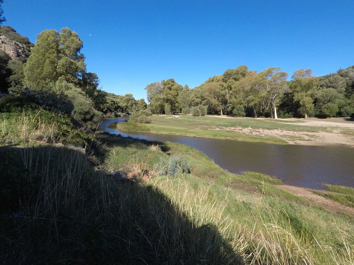 Scenic view of landscape against clear blue sky