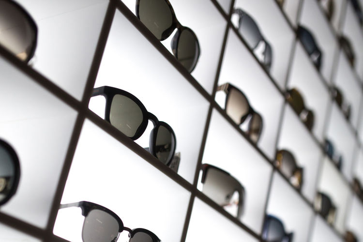 Full frame shot of sunglasses on shelf at store
