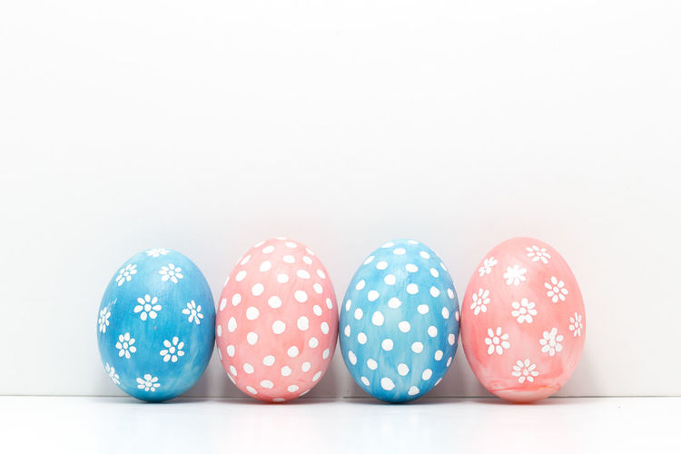Close-up of easter eggs against white background