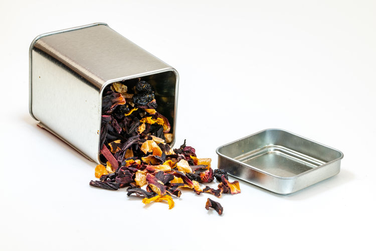 Hibiscus dried fruit tea from a metallic tin container