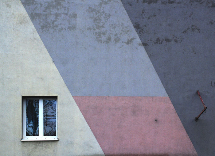Small window on gray wall