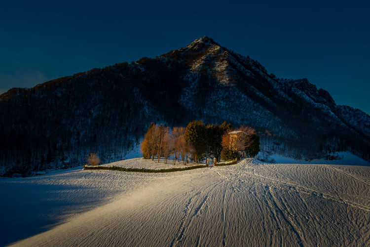 Isolated cottage in the snow