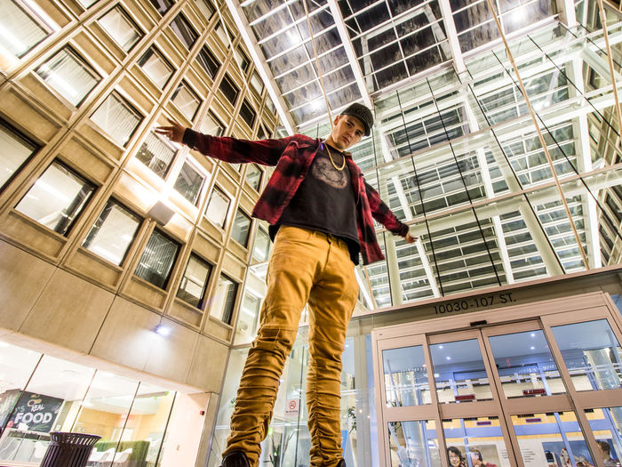 Low angle view of man standing on office building