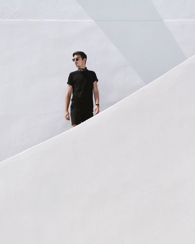 Portrait of young man standing outdoors