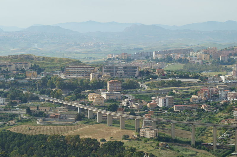 High angle view of buildings in city against sky
