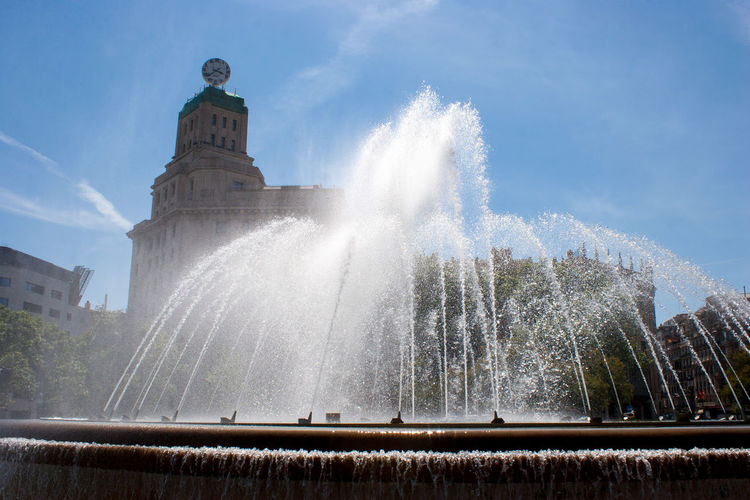 Low angle view of fountain against sky