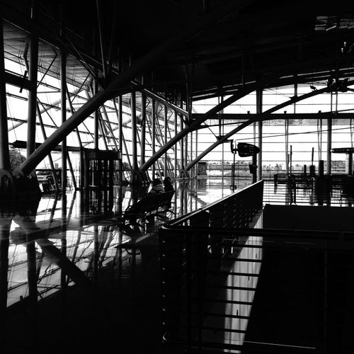 Silhouette people on glass of building