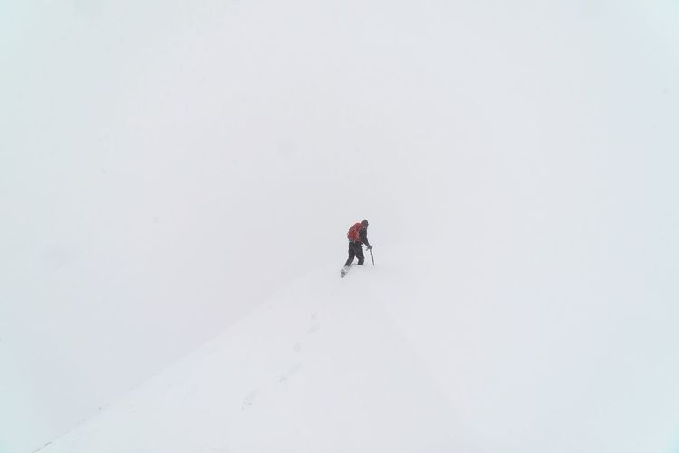 Full length of man jumping in snow