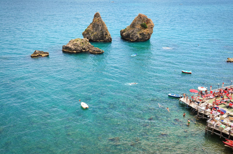 High angle view of stack rocks in sea at vietri sul mare