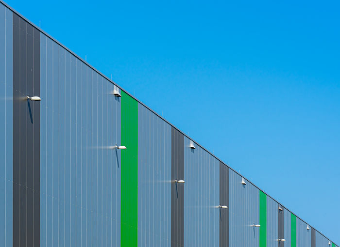 Low angle view of building against blue sky