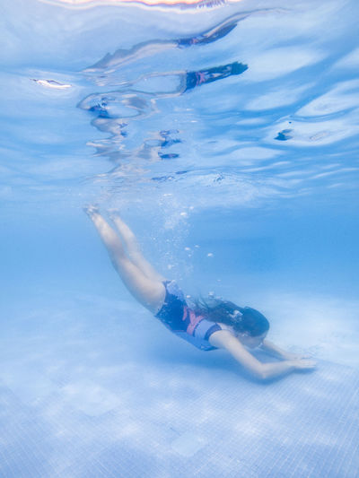 Full length of woman swimming in pool