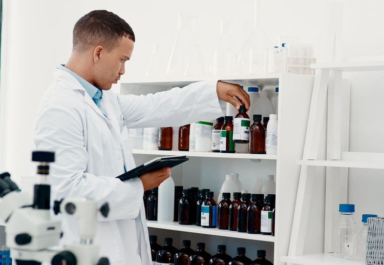 Side view of man working in laboratory