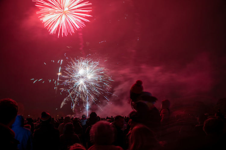 Crowds watching the annual bicester round table fireworks disaplay at pingle field, bicester