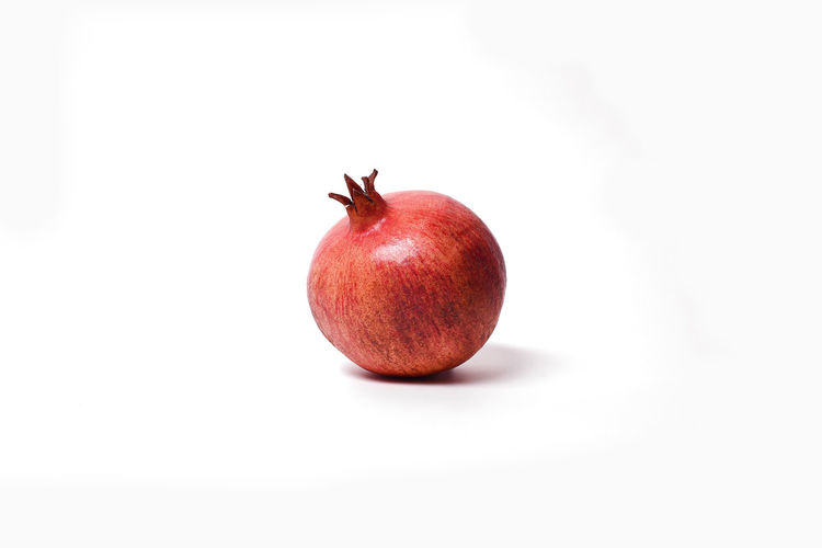 Close-up of apple against white background