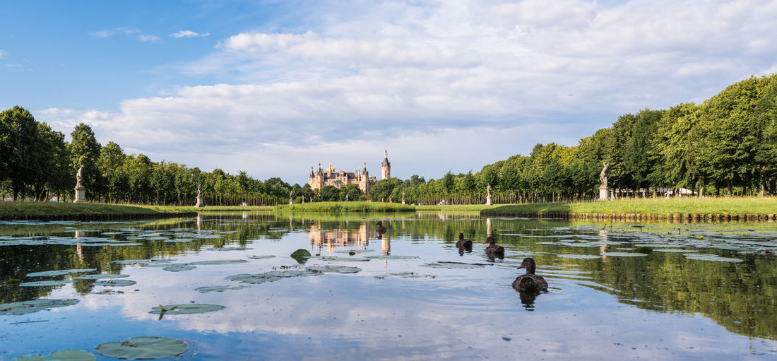 Schwerin castle and lake against cloudy sky