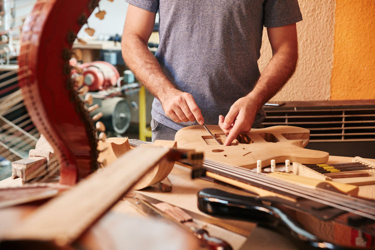 Midsection of man working