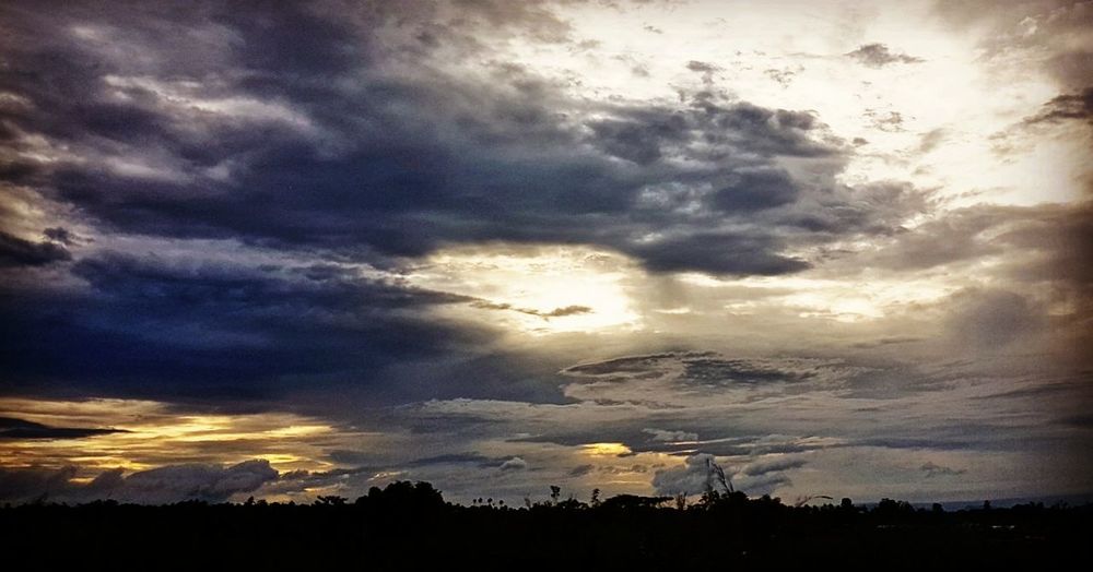 Scenic view of dramatic sky during sunset