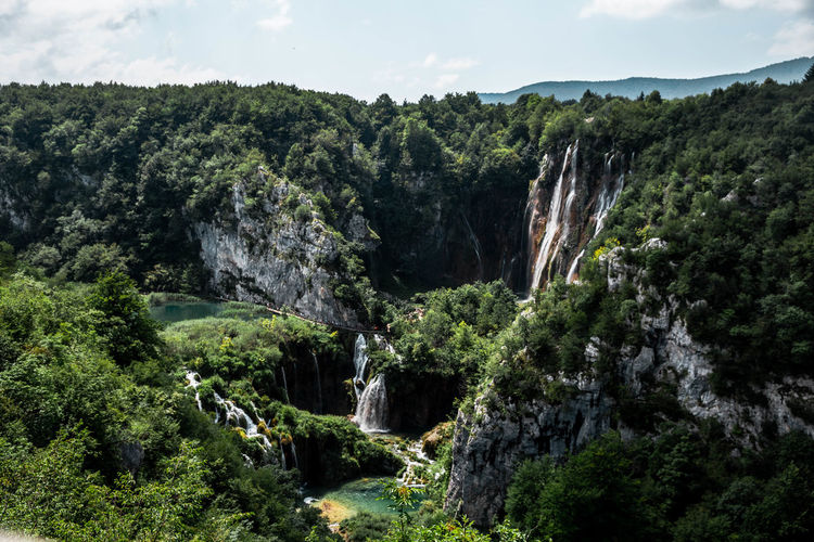 Scenic view of rocky mountains against sky including waterfalls and nature in plitvice national park 
