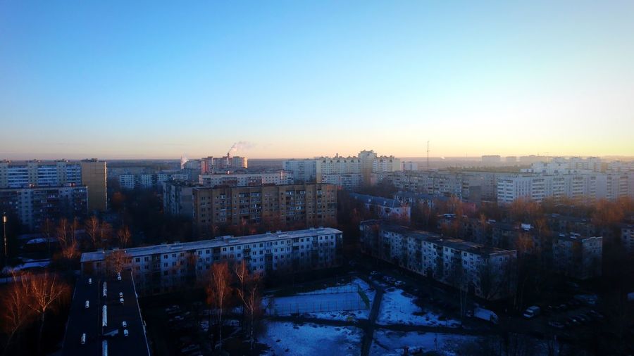 High angle view of buildings against sky during winter