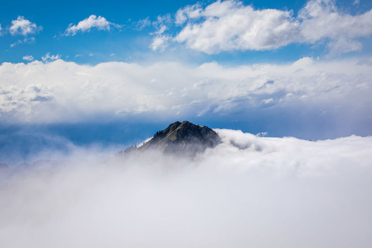 Top of mountain in a flood of clouds