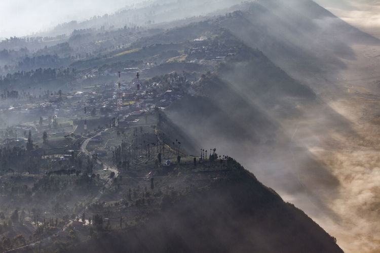 Aerial view of ngadisari village, probolinggo, indonesia on foggy morning