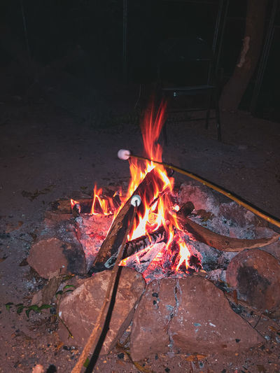 High angle view of fire burning at night