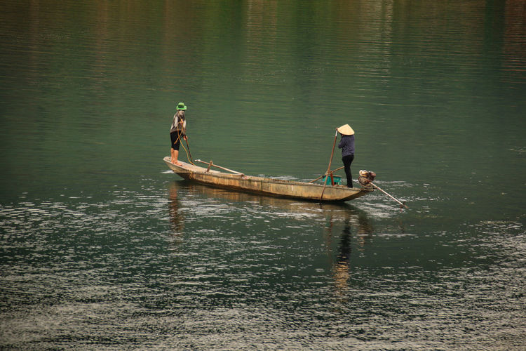 High angle view of people on a wooden boat in phong nha, vietnam