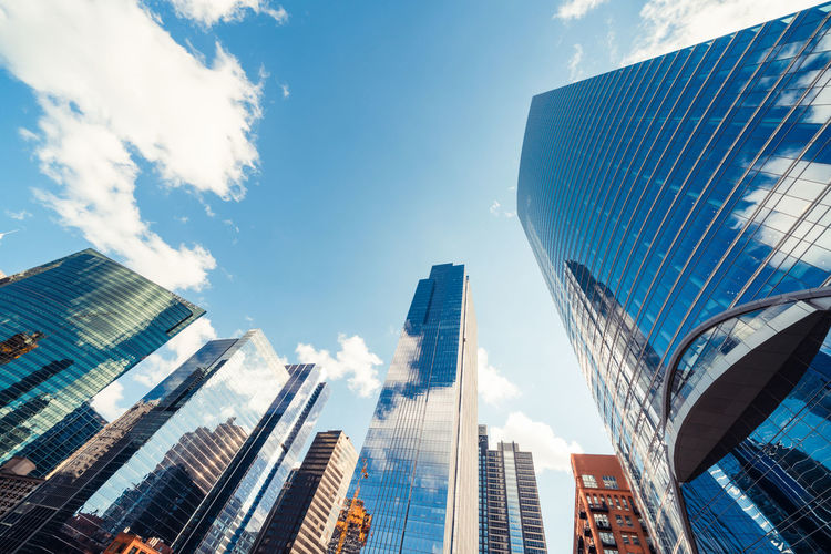 Low angle view of modern buildings against sky