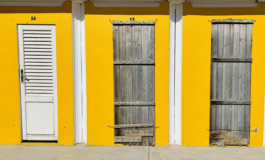 Closed door of yellow building