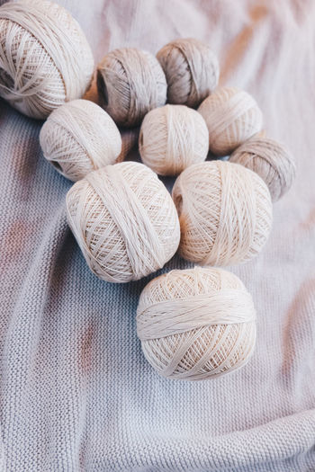 High angle view of string balls on tablecloth