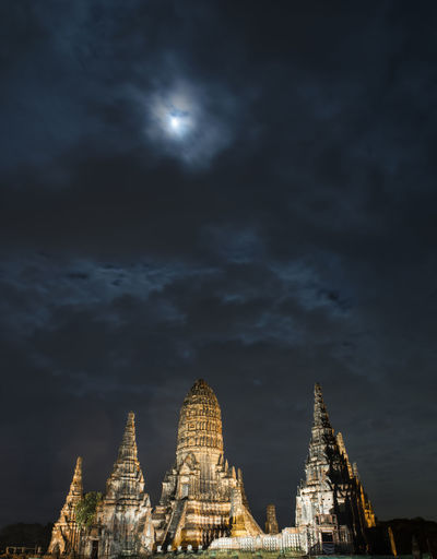 Pagodas against cloudy sky during night at phra nakhon si ayutthaya
