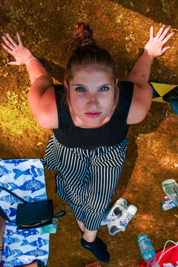 Portrait of woman sitting at park