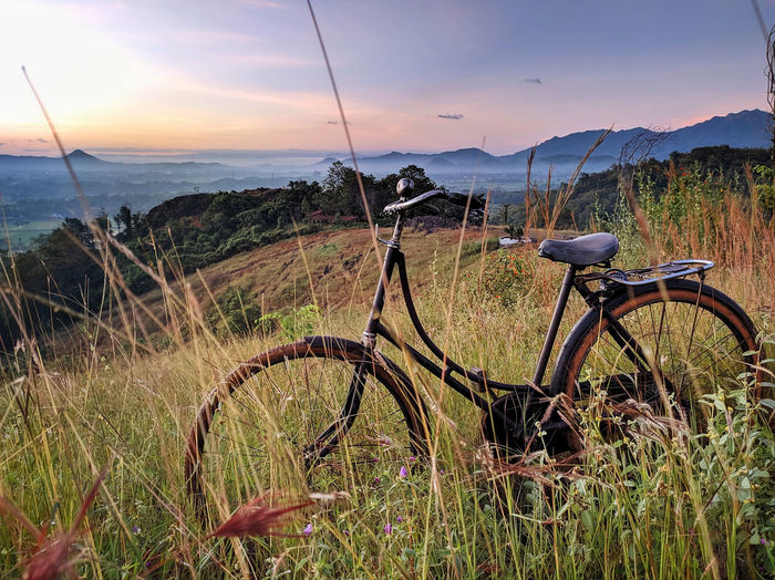 Bicycles on field against dramatic sky,location on sukoharjo,indonesia.