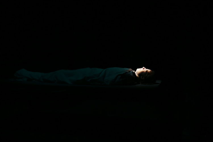 Man sleeping in darkroom