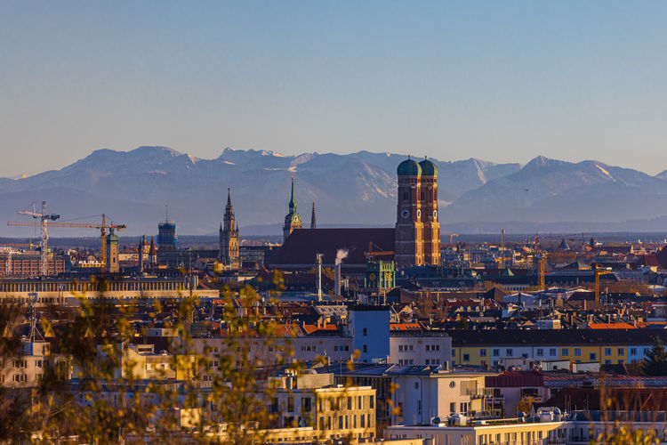 Munich skyline frauenkirche with the alps in the background