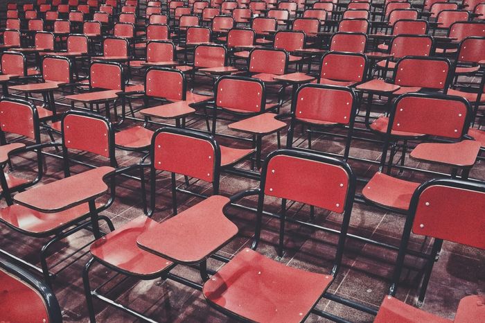 Full frame shot of red chairs in stadium