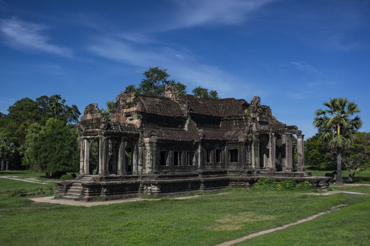 Old temple against cloudy sky