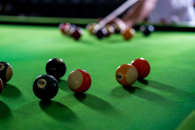 Multi colored pool balls on table