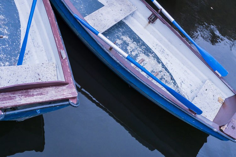 Close-up of boat moored in water