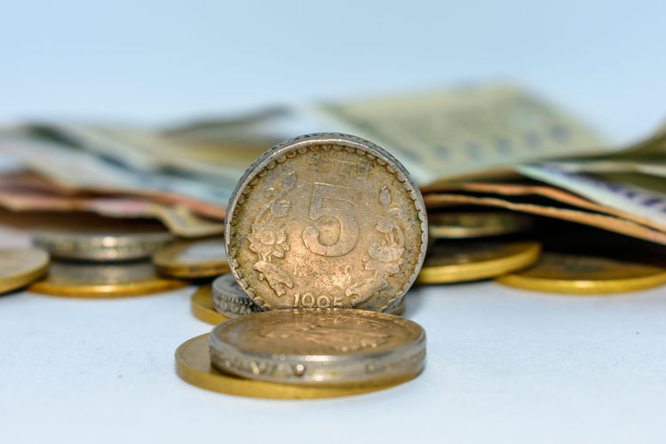 Close-up of coins and paper currency
