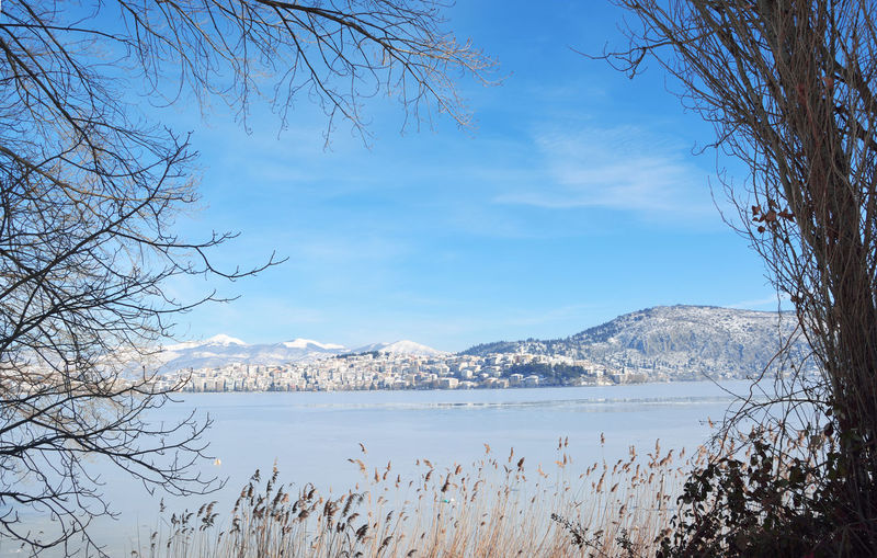 Lake orestiada and town of kastoria in greece covered with snow