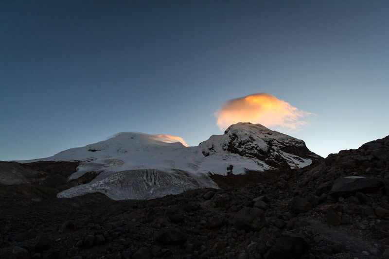 Scenic view of snowcapped mountains against clear sky