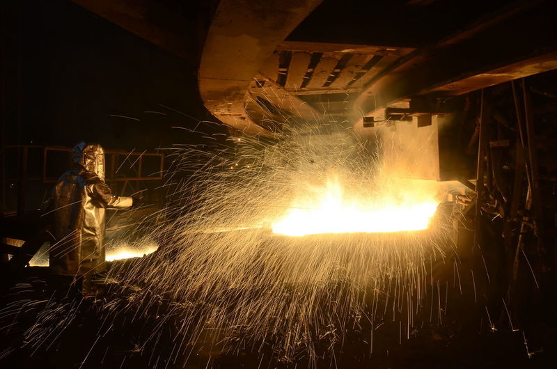 View of fire in factory at night