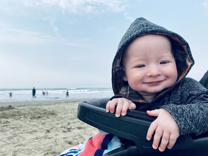 Portrait of cute baby boy on beach