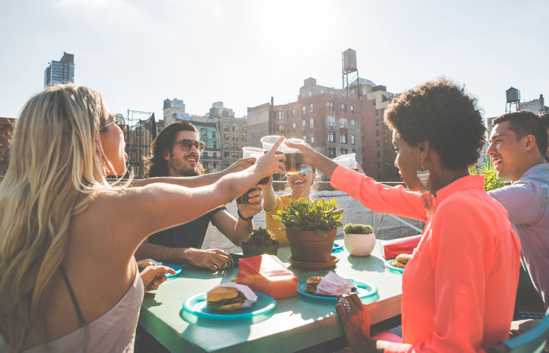 Group of people on table in city
